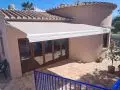 Toldo de brazos con motor y central sol viento