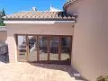 Toldo de brazos con motor y central sol viento