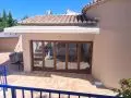 Toldo de brazos con motor y central sol viento